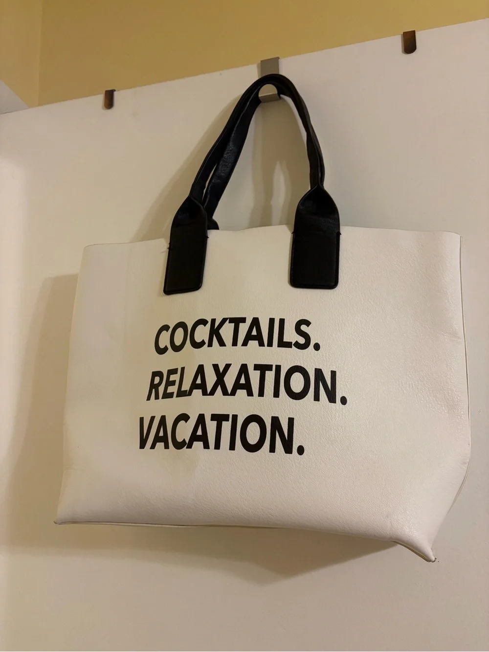 White Tote Bag with Black Handles and Bold Black Text